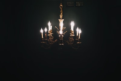 gold and white uplight chandelier